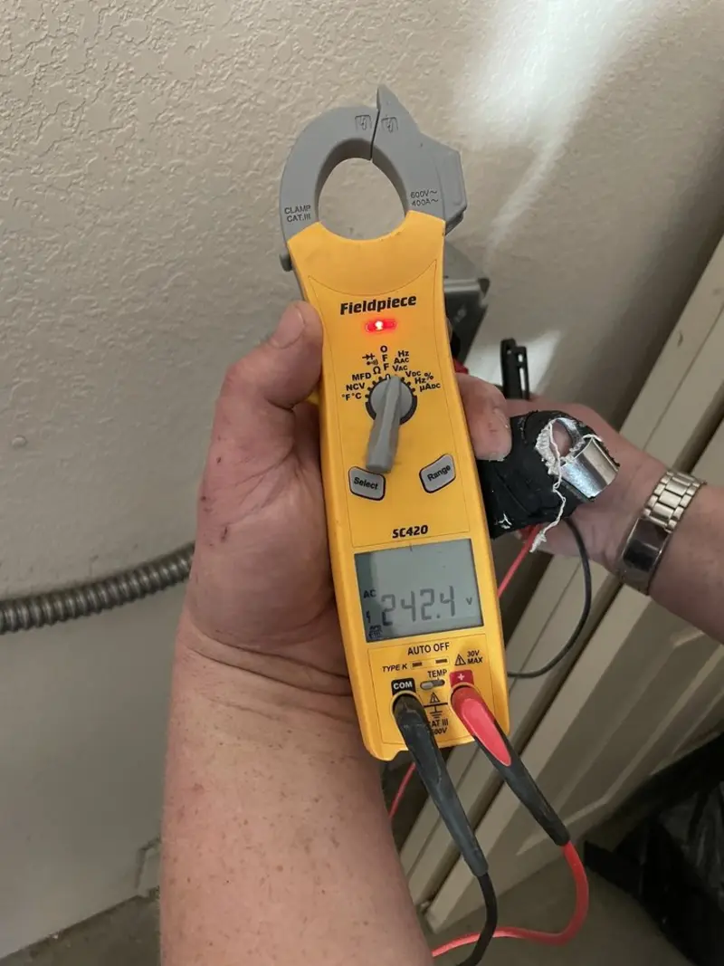 Voltage testing with clamp meter during Circuit Breaker Repair in Uxbridge